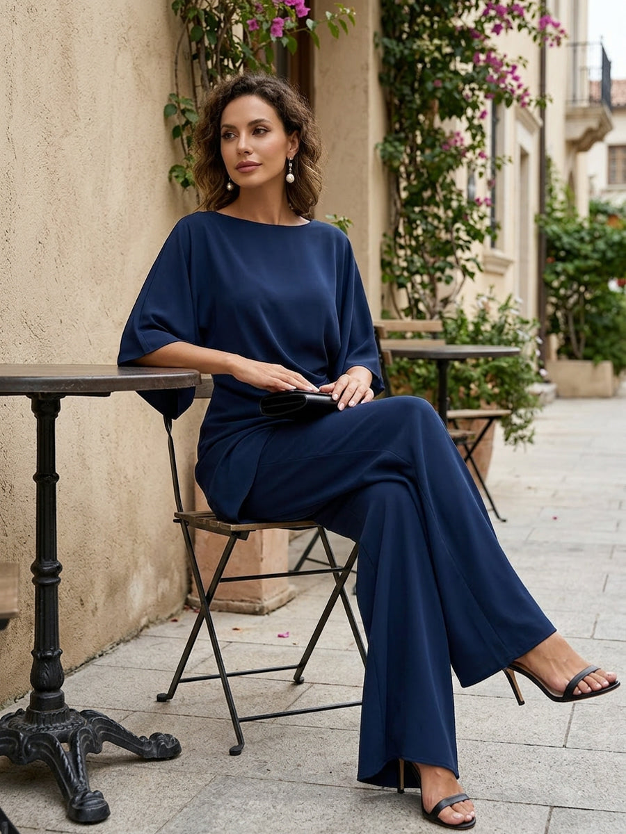 Completo donna elegante con top drappeggiato e pantaloni larghi