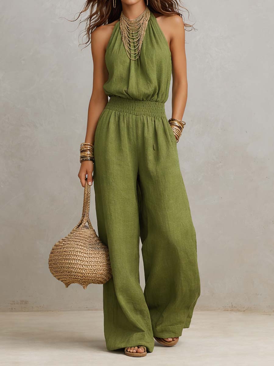 Tuta donna elegante con scollo halter e pantaloni larghi