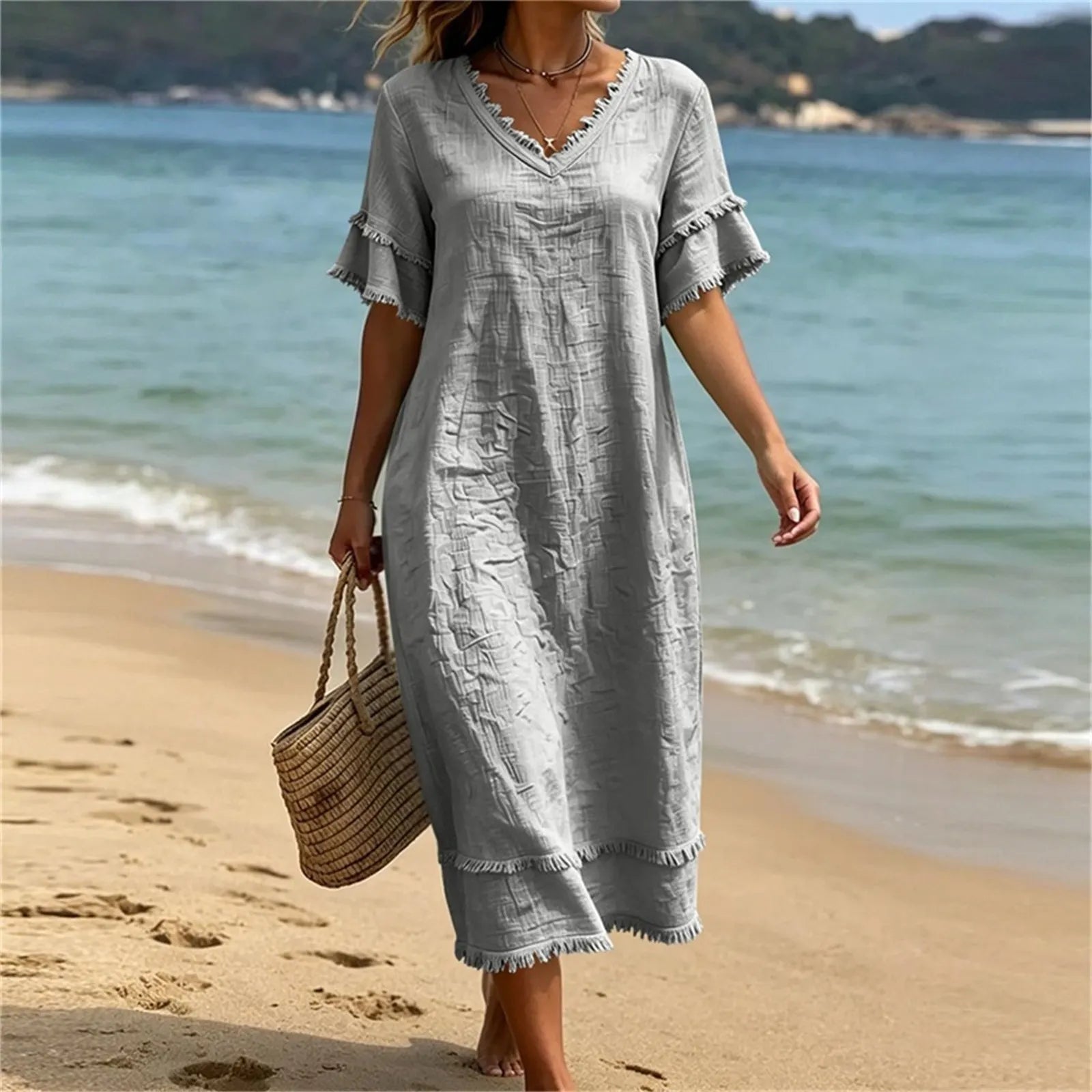 Abito donna bohémien con scollo a V e frange