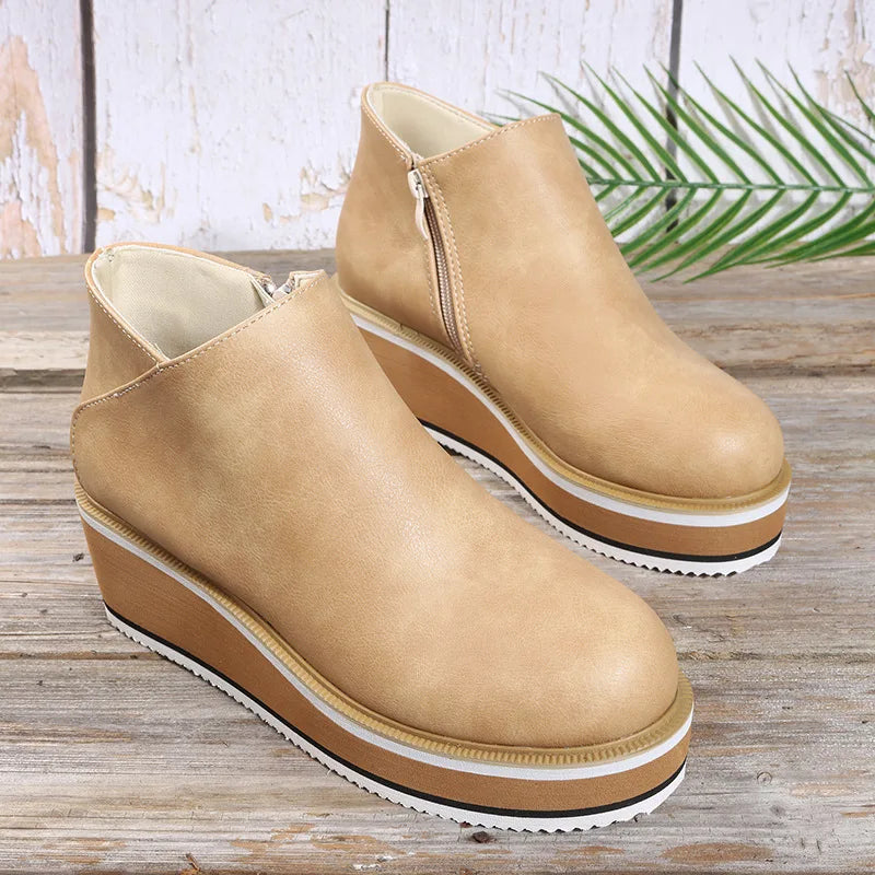 Stivaletti donna con zeppa platform e chiusura zip laterale