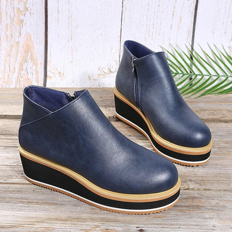 Stivaletti donna con zeppa platform e chiusura zip laterale