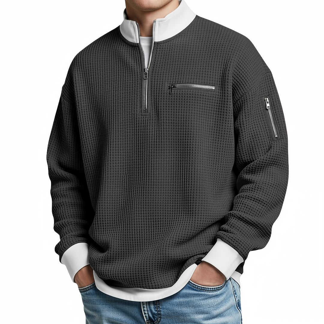 Maglione uomo waffle con mezza zip e tasche con cerniera