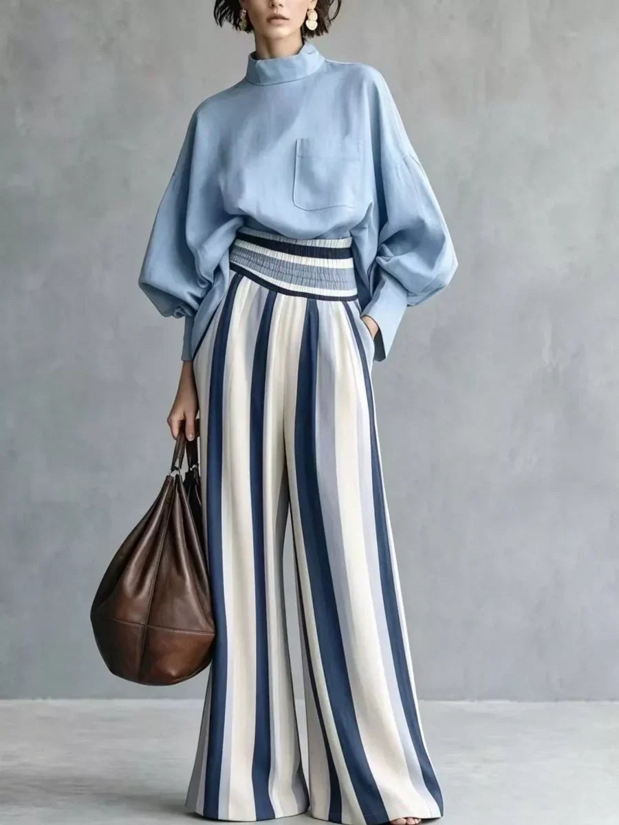 Completo donna elegante con top a collo alto e pantaloni palazzo a righe