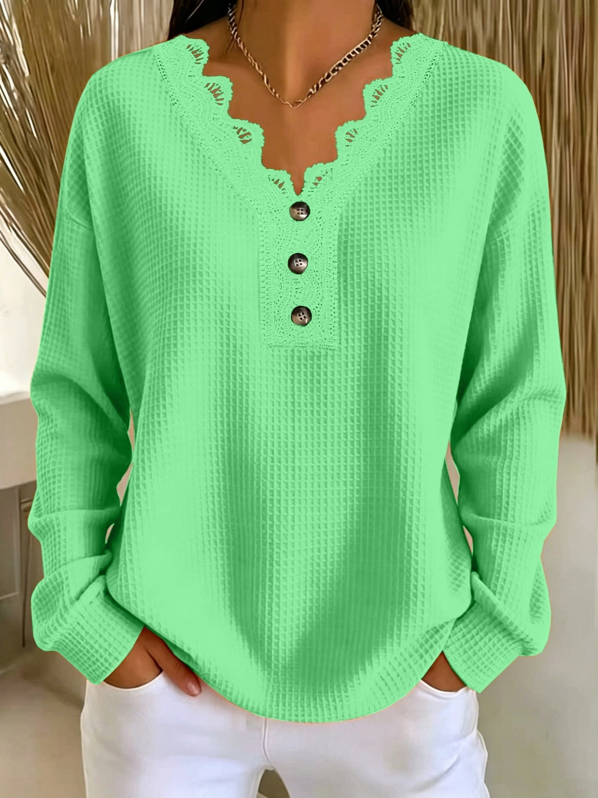 Top donna testurizzato con scollo a V in pizzo