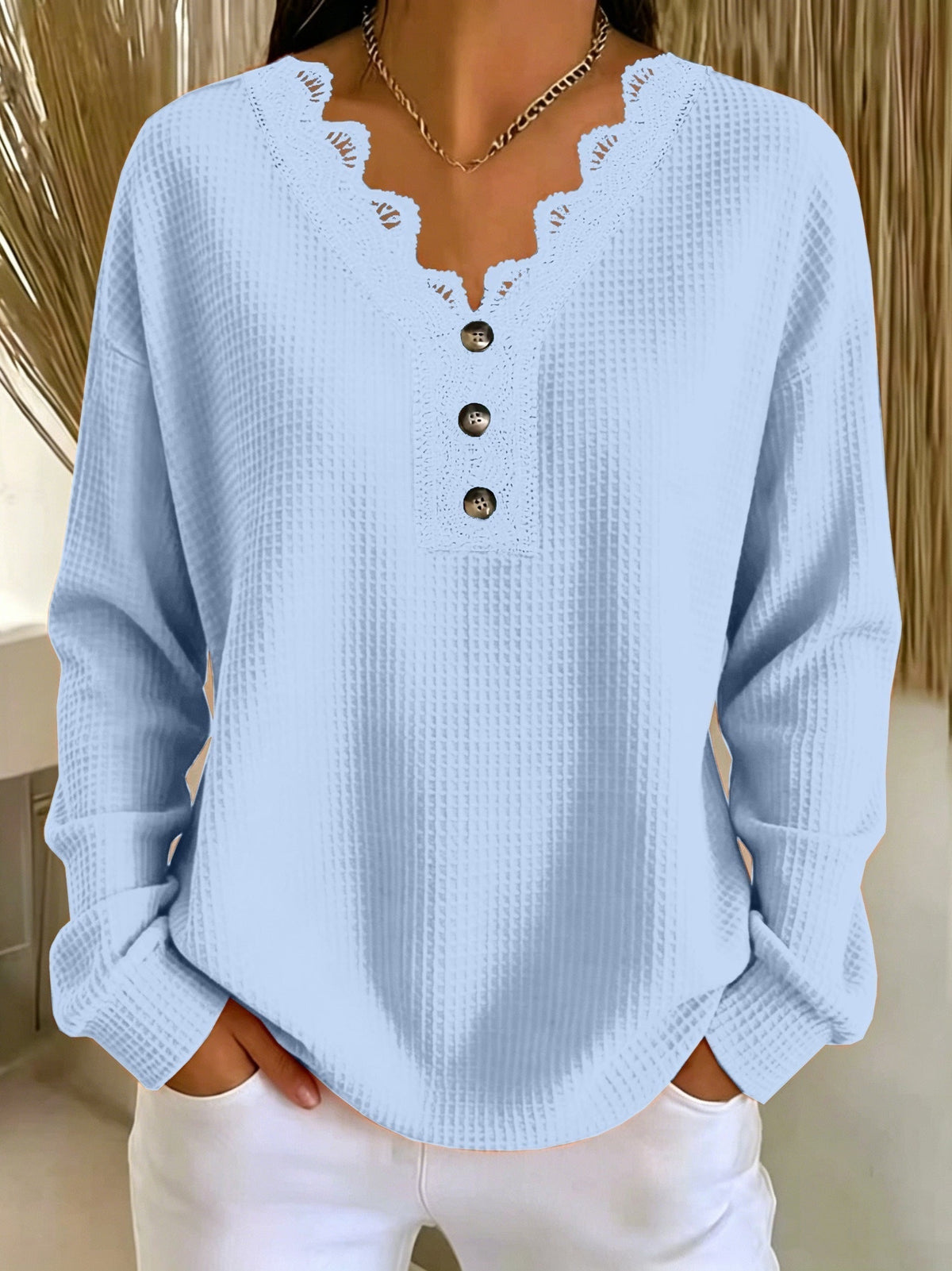 Top donna testurizzato con scollo a V in pizzo