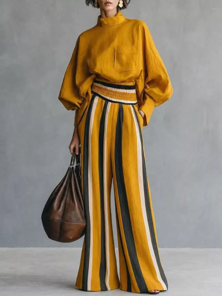 Completo donna elegante con top a collo alto e pantaloni palazzo a righe