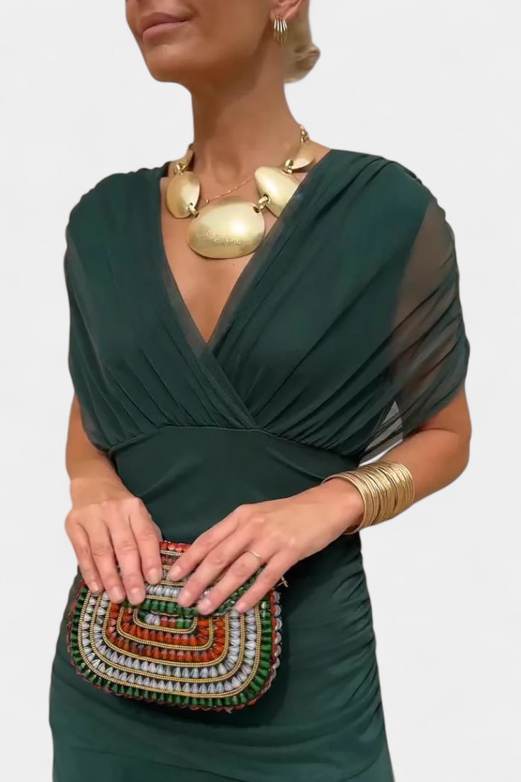 Abito lungo da donna elegante con scollo drappeggiato