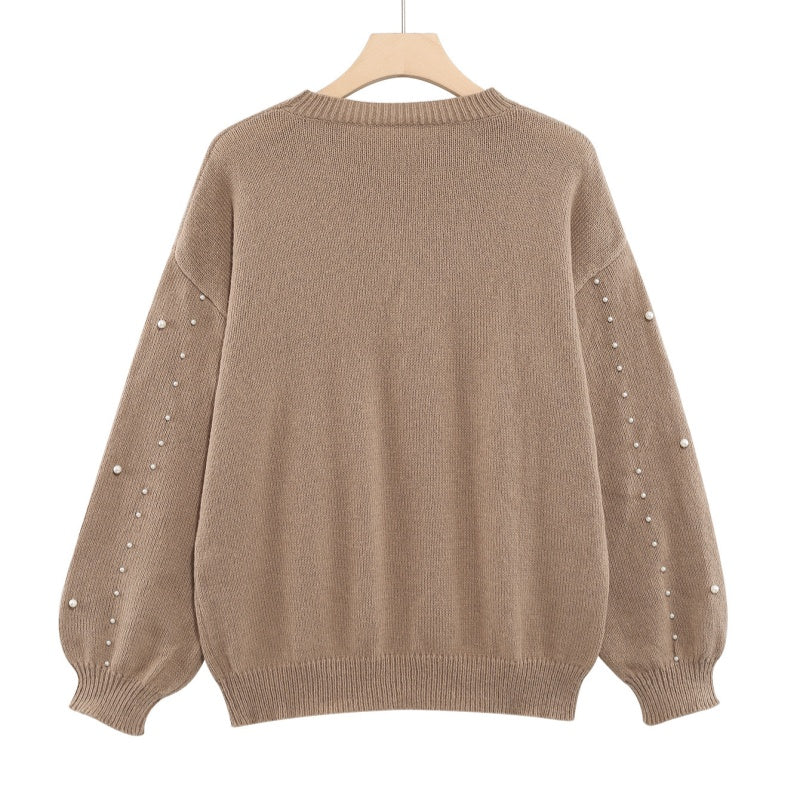 Maglione donna con perle decorative e maniche morbide