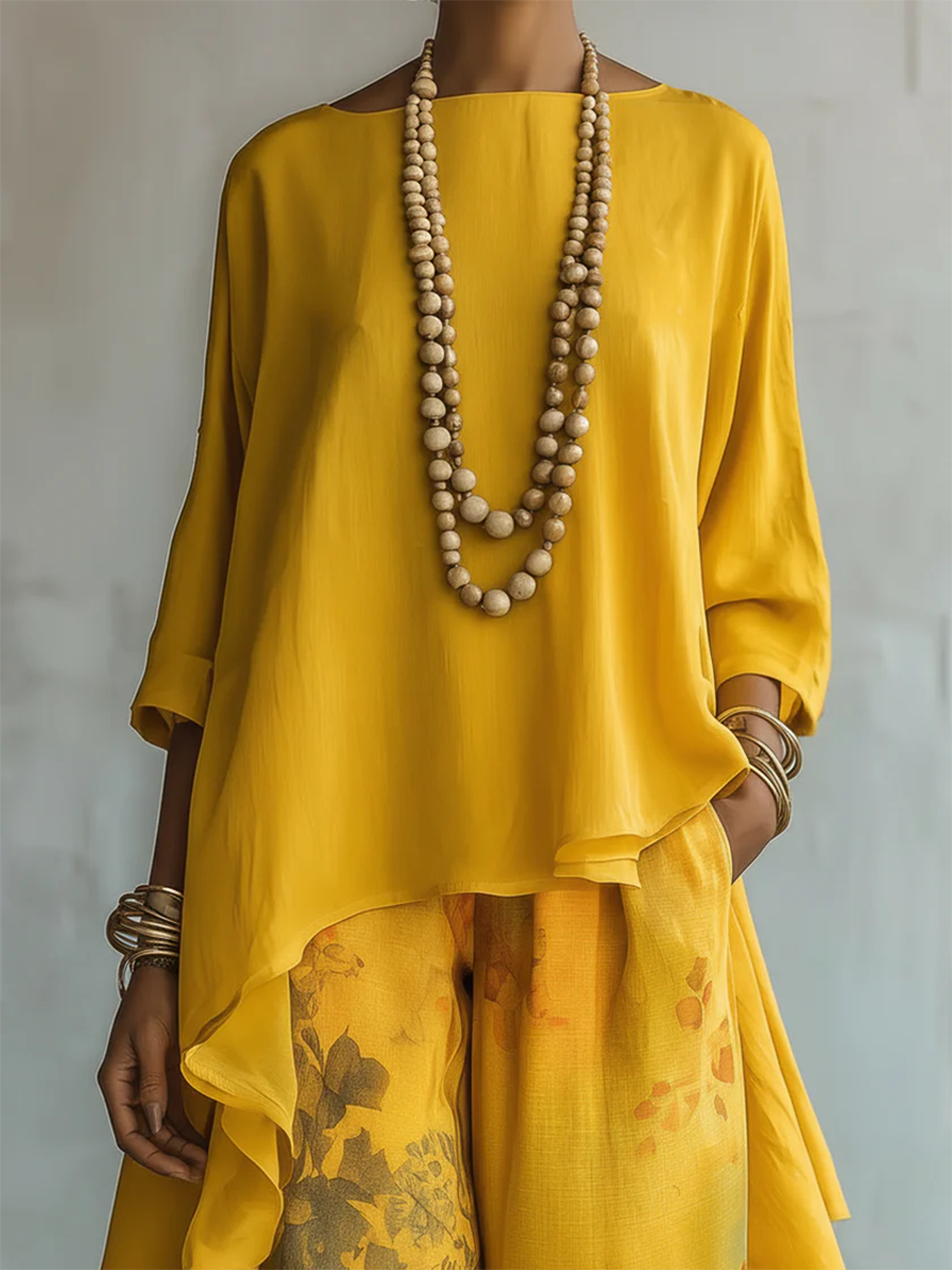 Completo donna boho con blusa asimmetrica e pantaloni floreali