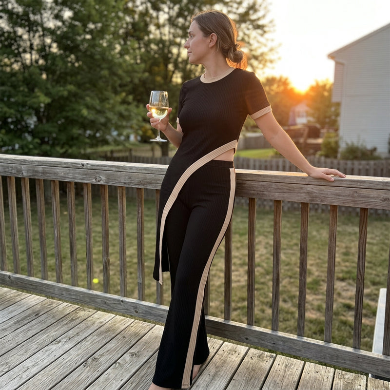 Completo da donna elegante con pantaloni a zampa