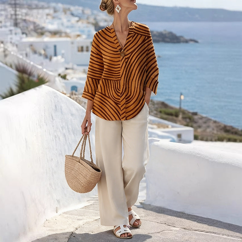 Completo donna a righe con pantaloni larghi