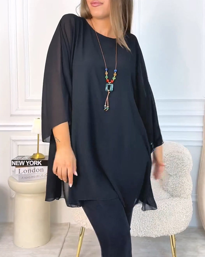 Top donna oversize con maniche a tre quarti e linea fluida