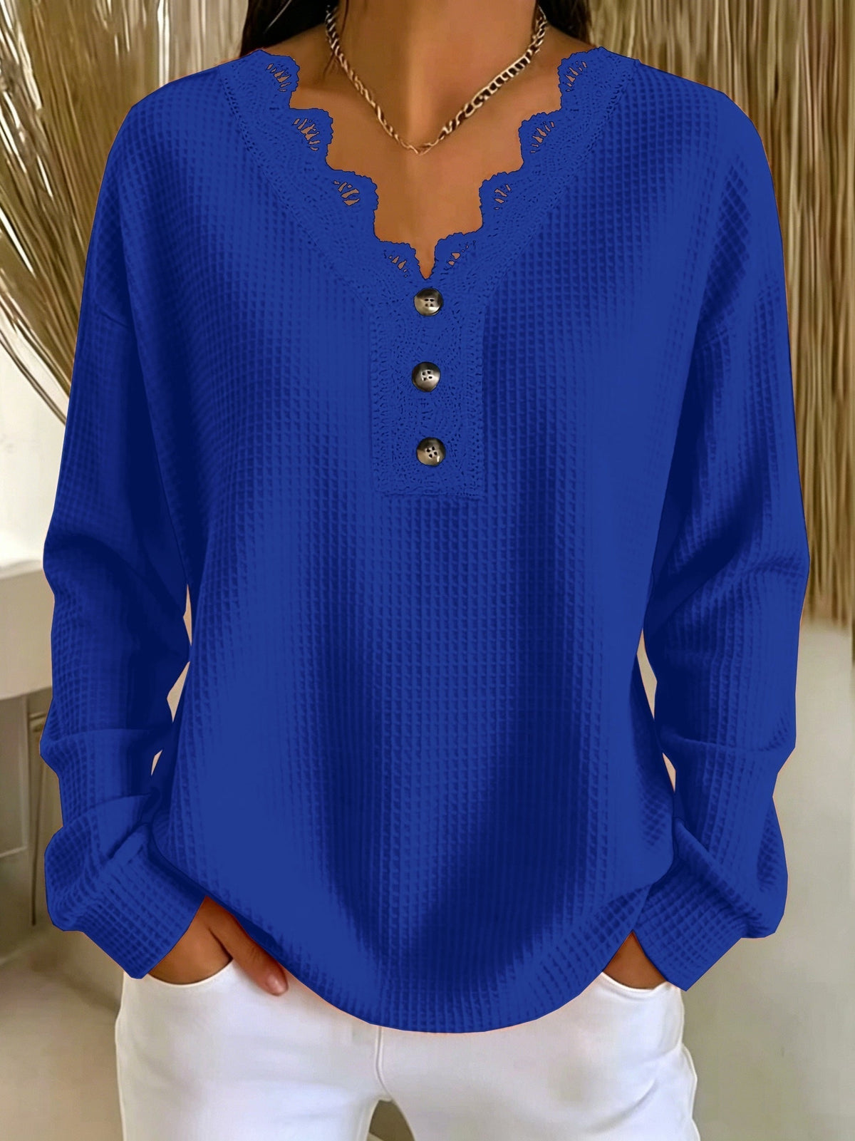 Top donna testurizzato con scollo a V in pizzo