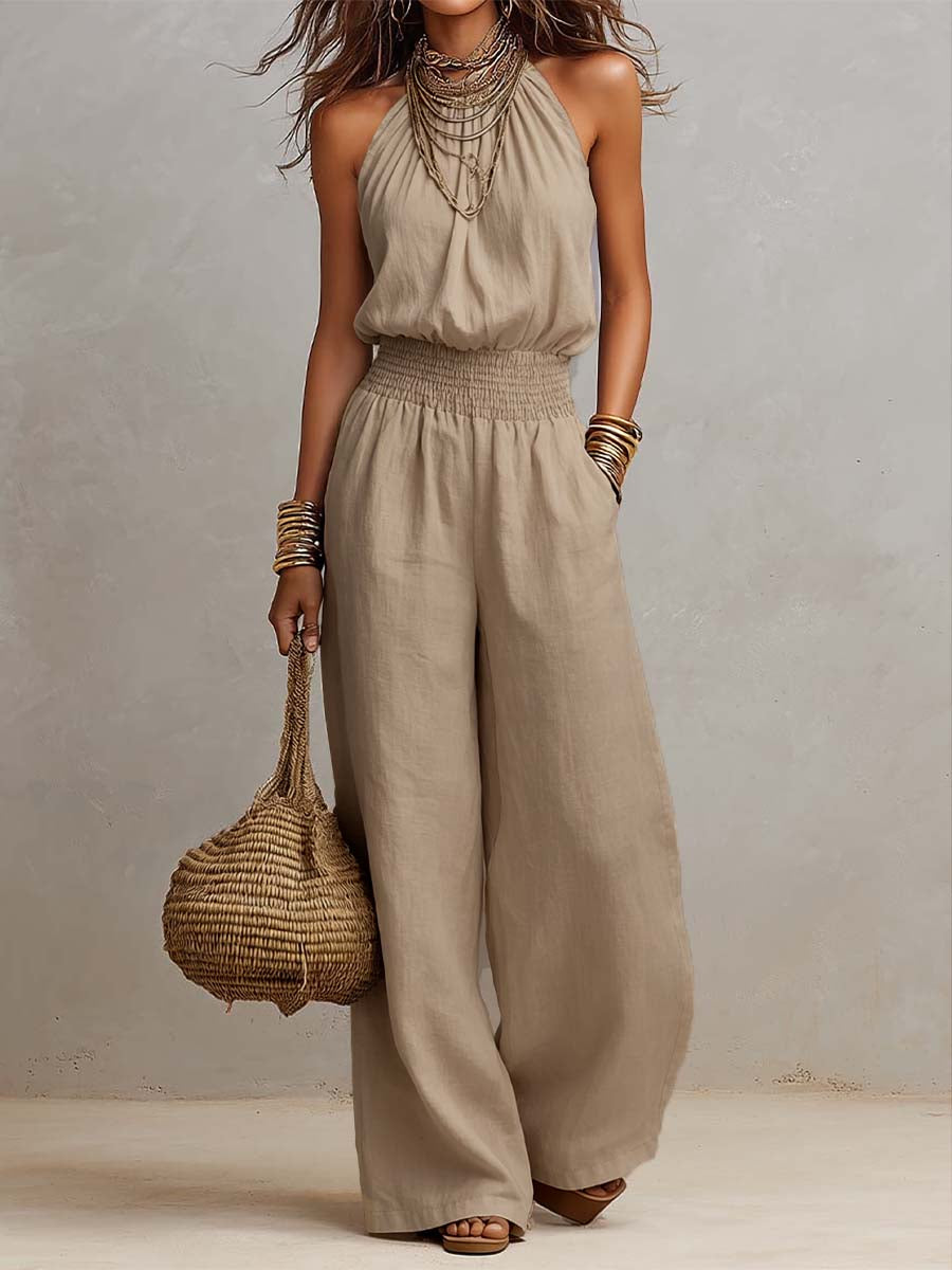 Tuta donna elegante con scollo halter e pantaloni larghi