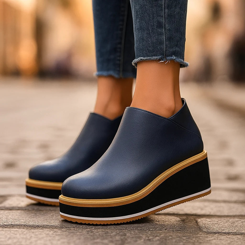 Stivaletti donna con zeppa platform e chiusura zip laterale