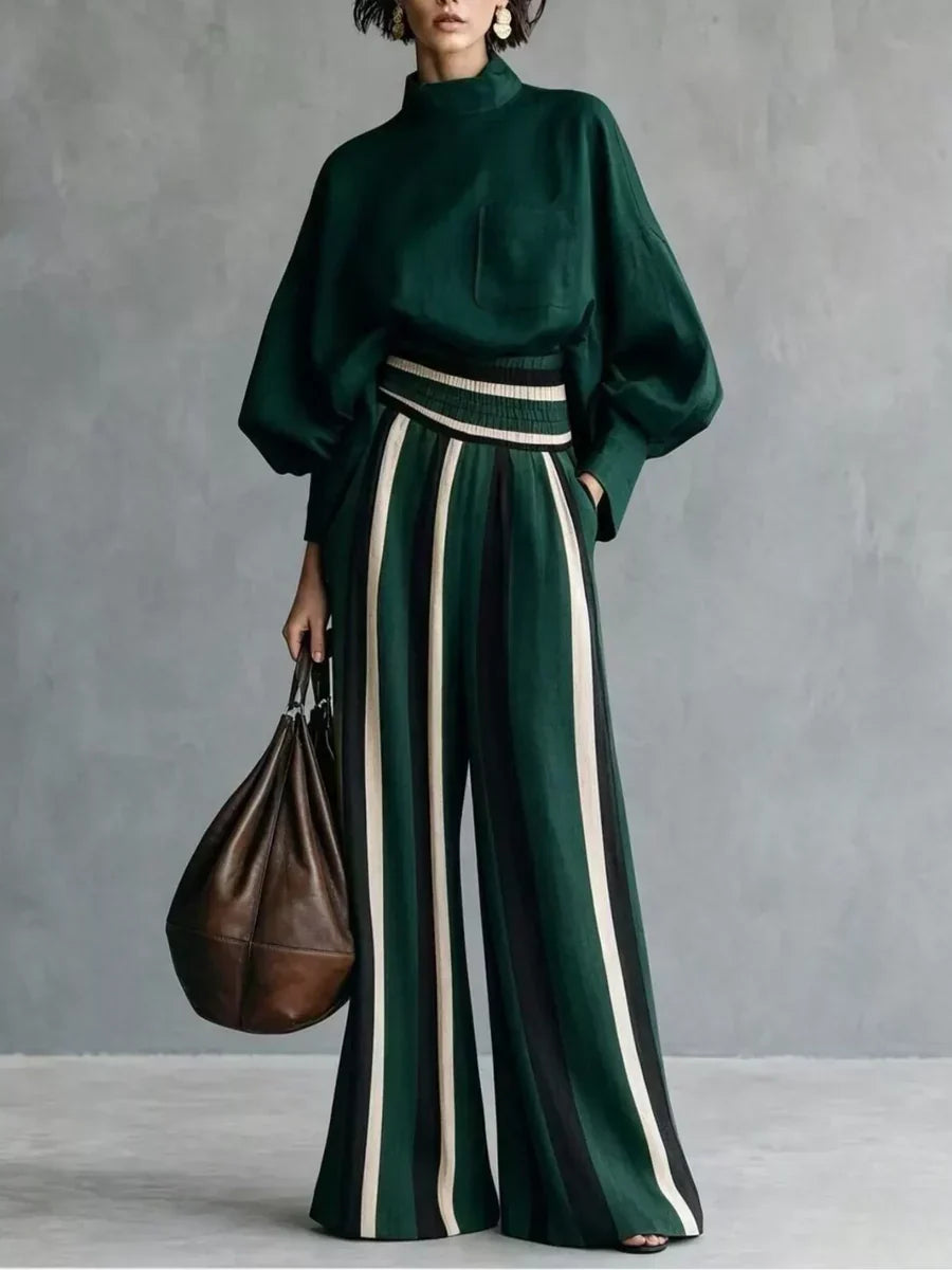 Completo donna elegante con top a collo alto e pantaloni palazzo a righe