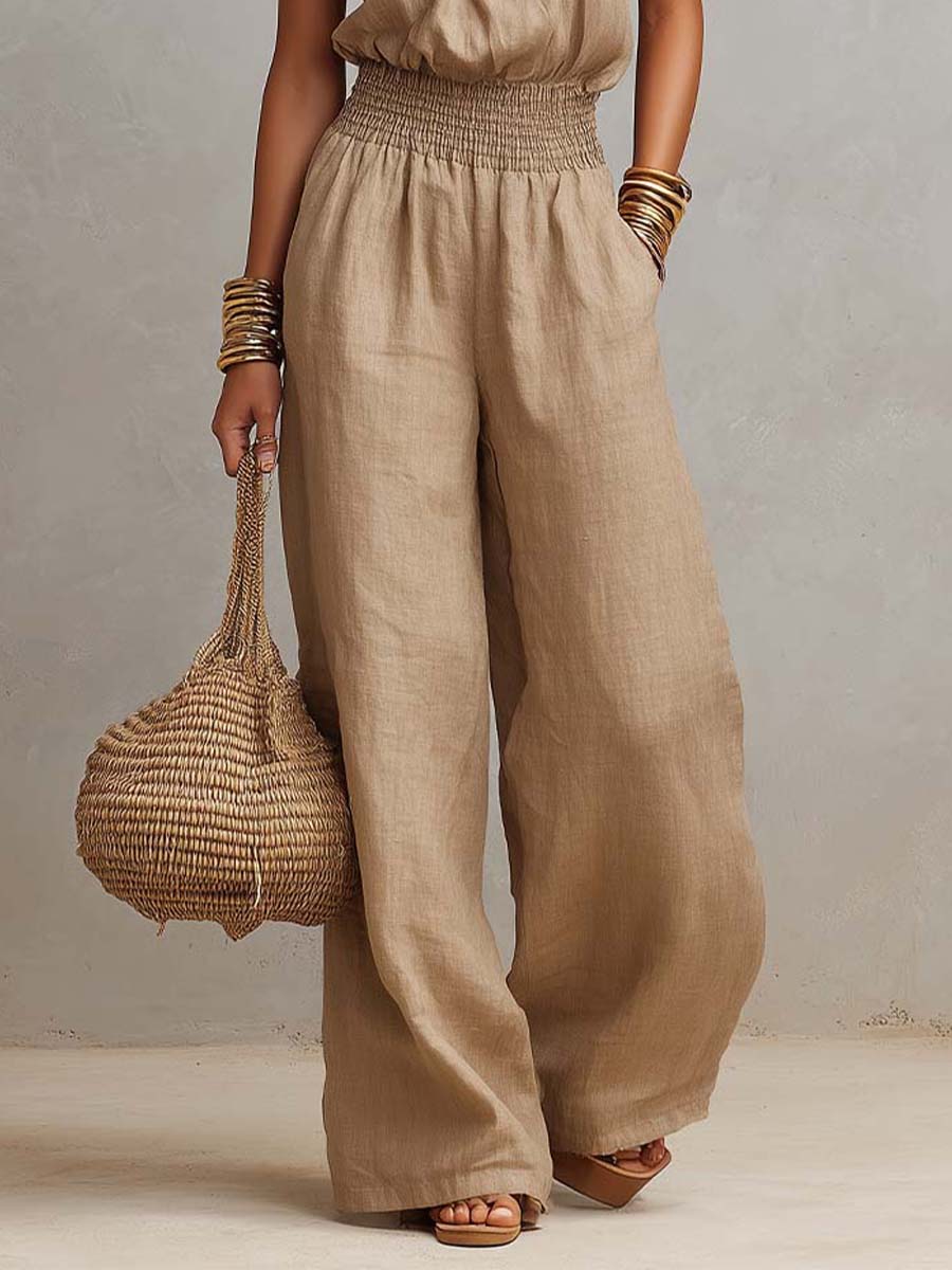 Tuta donna elegante con scollo halter e pantaloni larghi