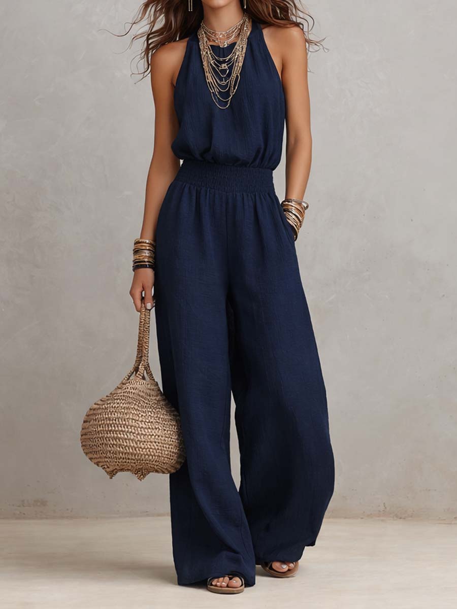 Tuta donna elegante con scollo halter e pantaloni larghi