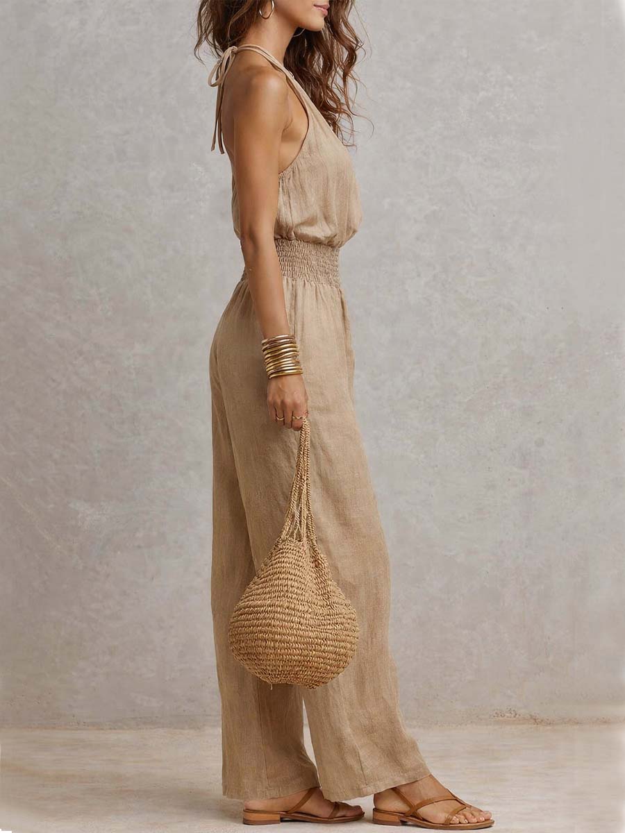 Tuta donna elegante con scollo halter e pantaloni larghi