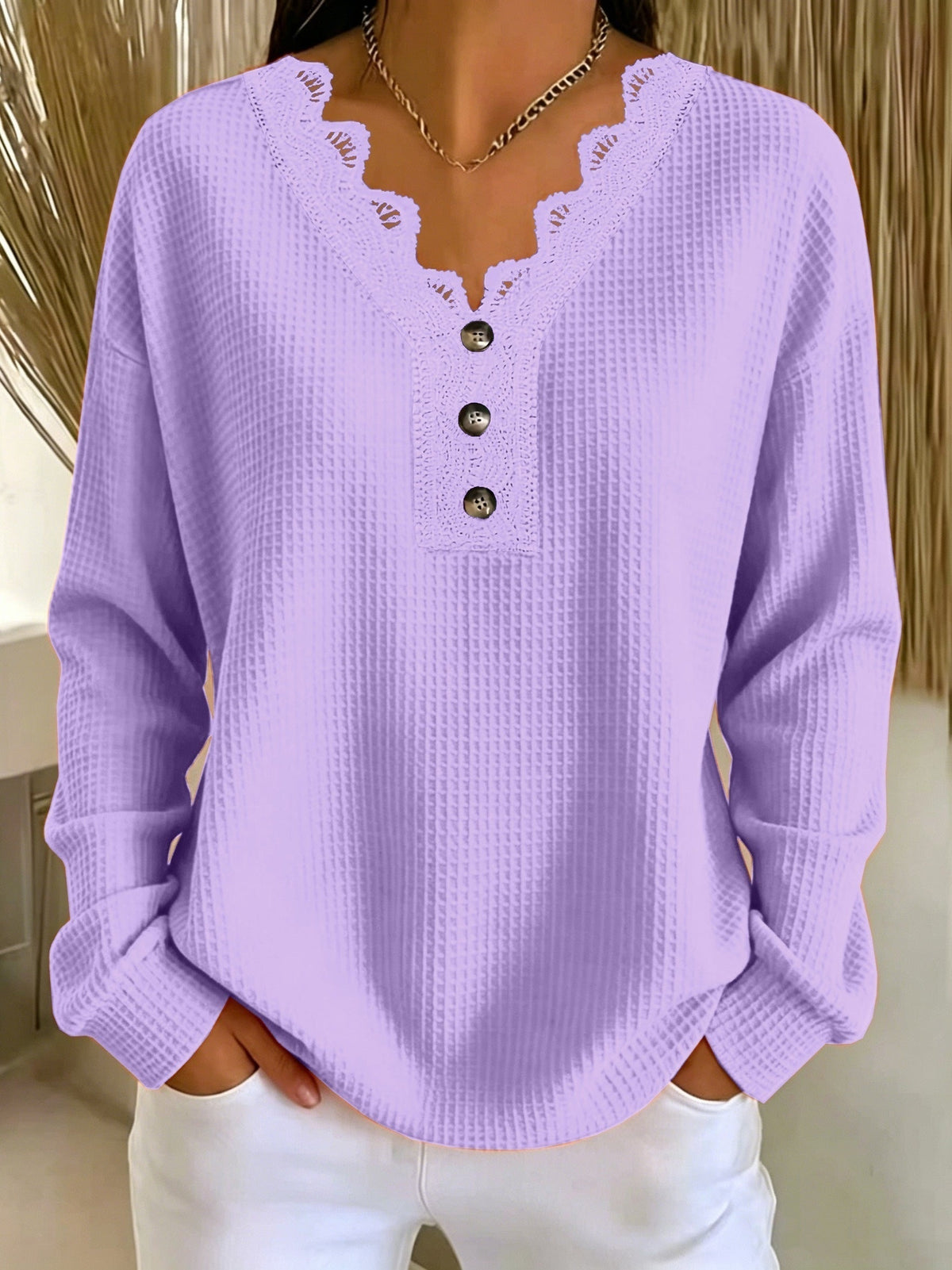 Top donna testurizzato con scollo a V in pizzo