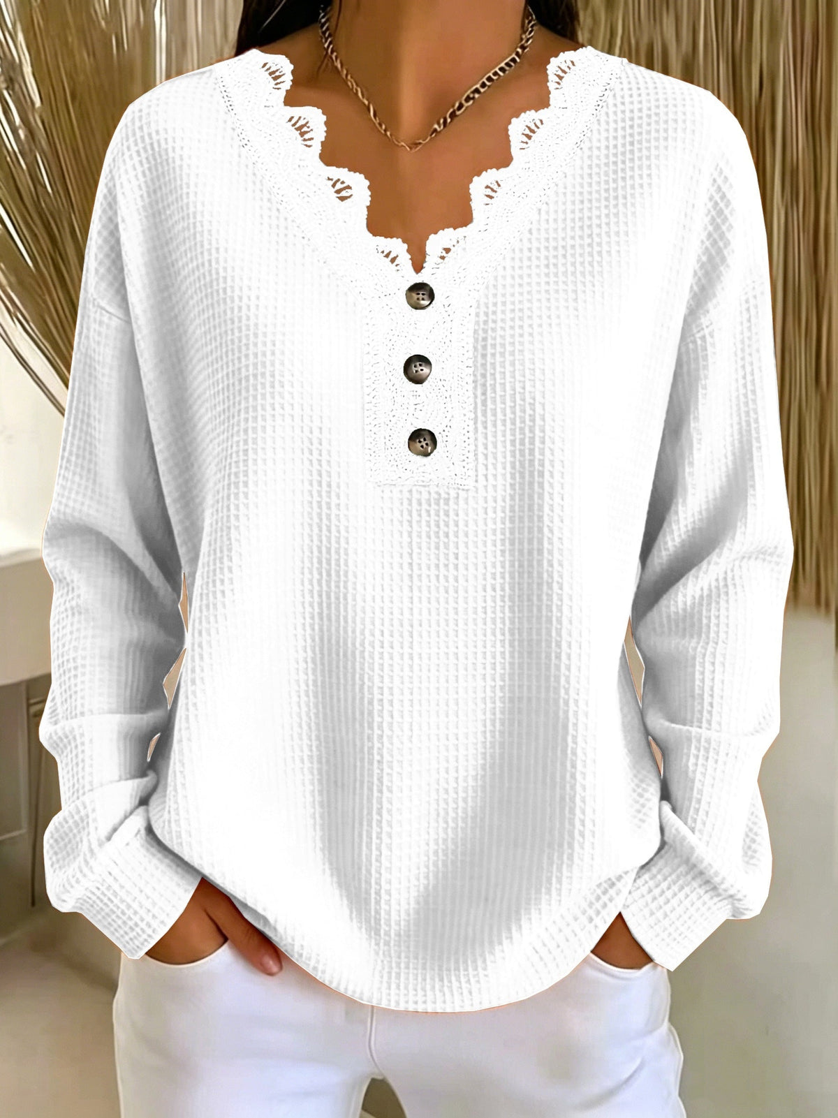 Top donna testurizzato con scollo a V in pizzo