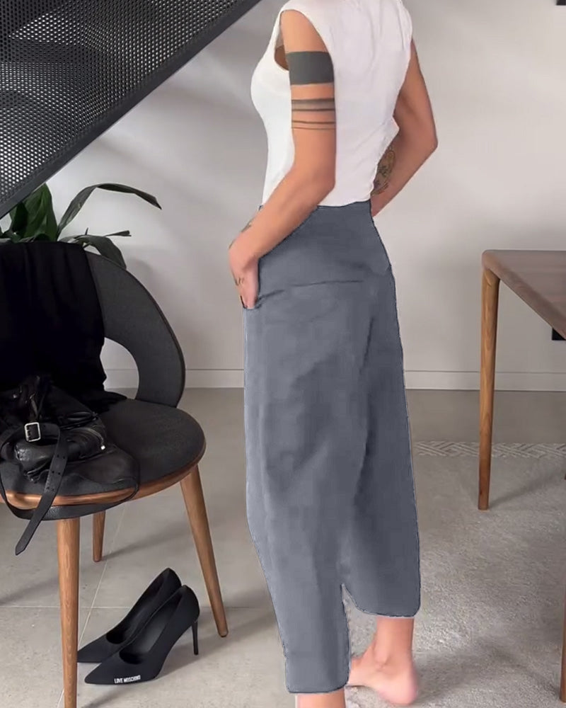 Pantaloni donna larghi asimmetrici con vita media