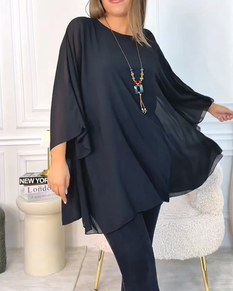 Top donna oversize con maniche a tre quarti e linea fluida