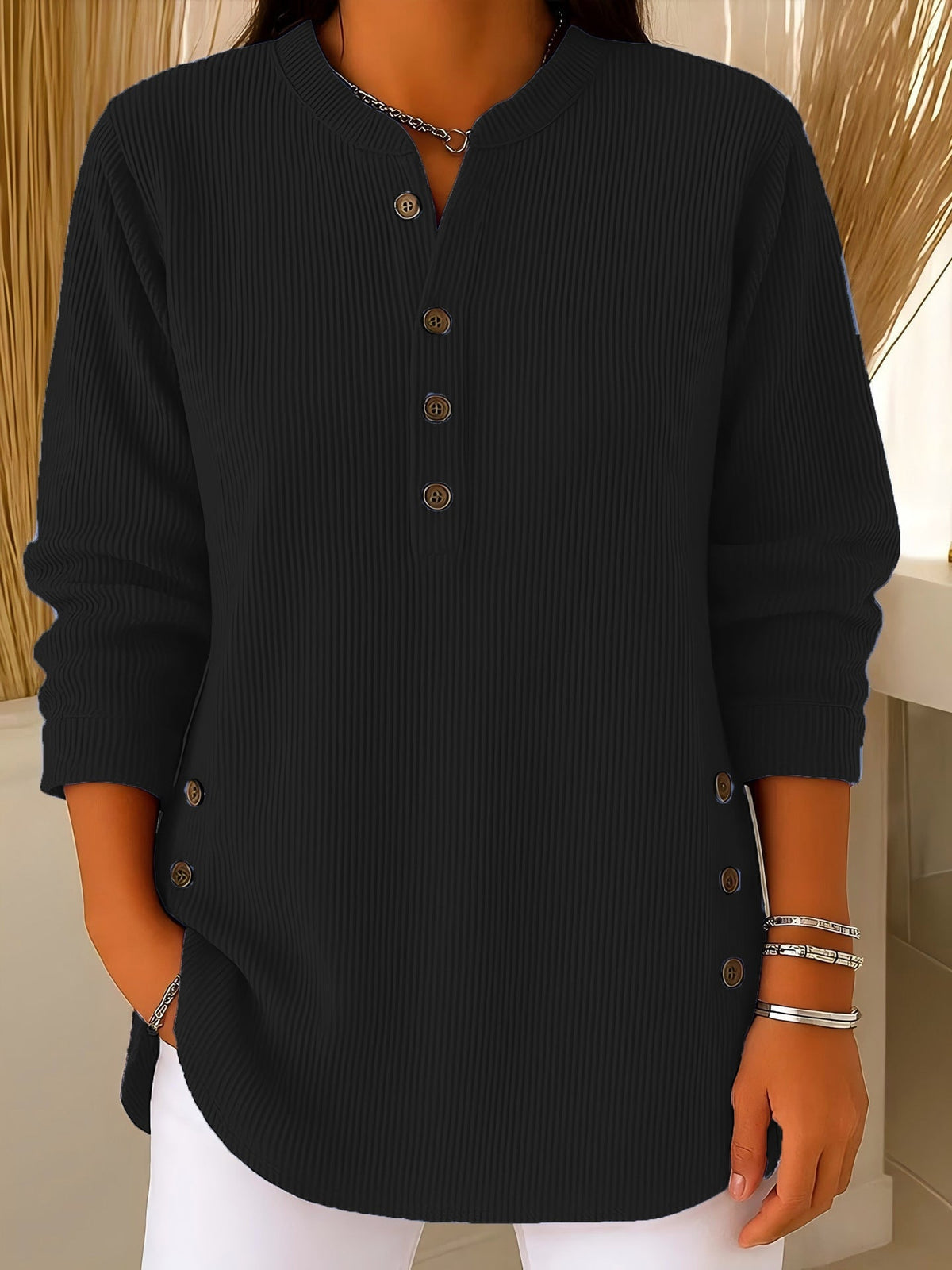 Blusa donna testurizzata con bottoni laterali e maniche lunghe
