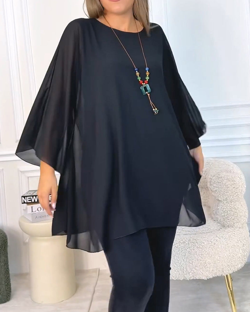 Top donna oversize con maniche a tre quarti e linea fluida