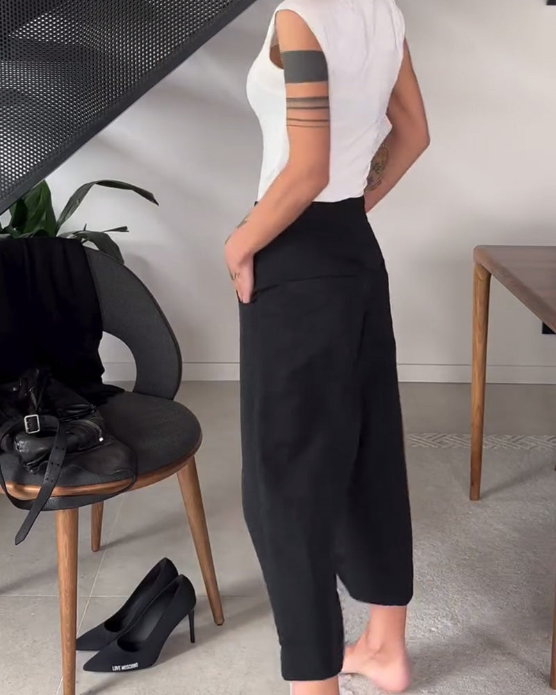 Pantaloni donna larghi asimmetrici con vita media