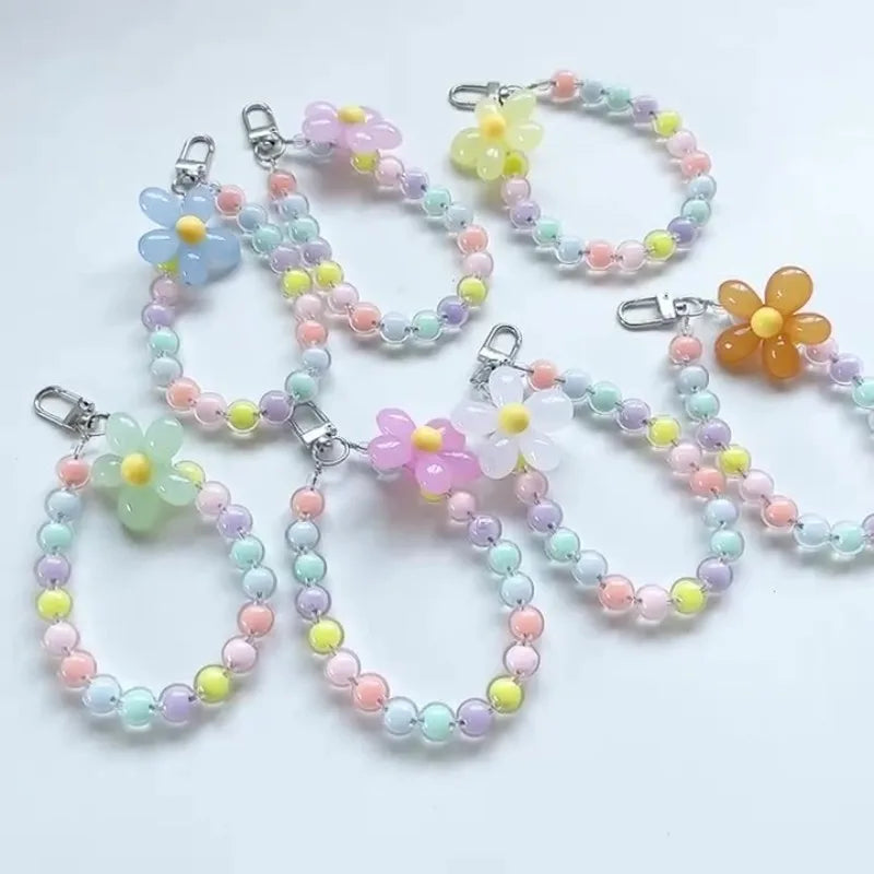 Laccetto telefono donna con perline macaron e fiore
