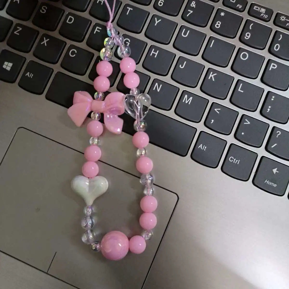 Laccetto telefono donna con perline macaron e fiore