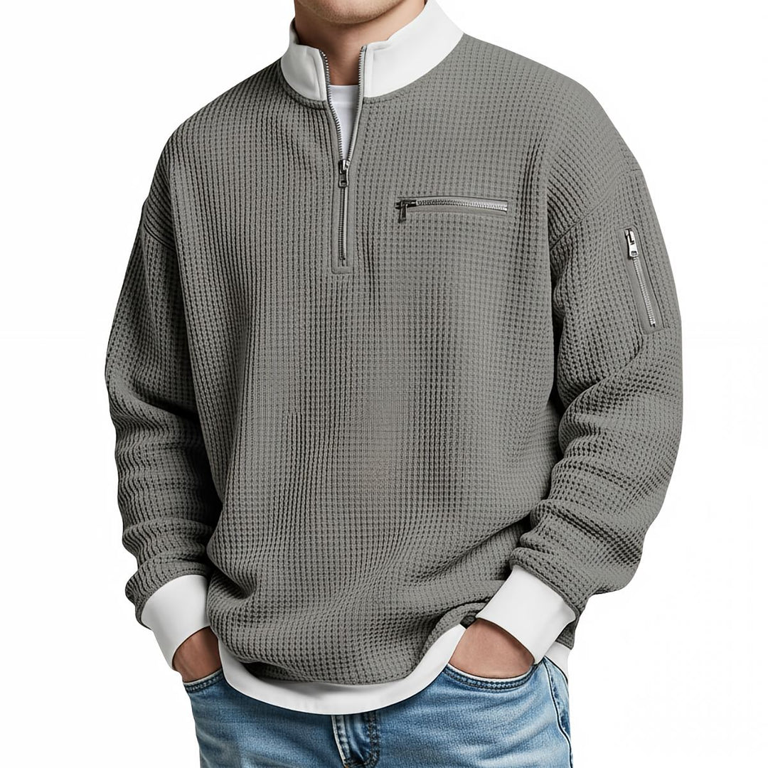 Maglione uomo waffle con mezza zip e tasche con cerniera