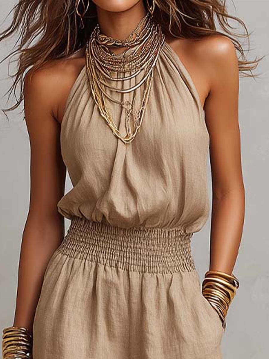 Tuta donna elegante con scollo halter e pantaloni larghi