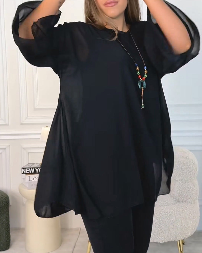 Top donna oversize con maniche a tre quarti e linea fluida