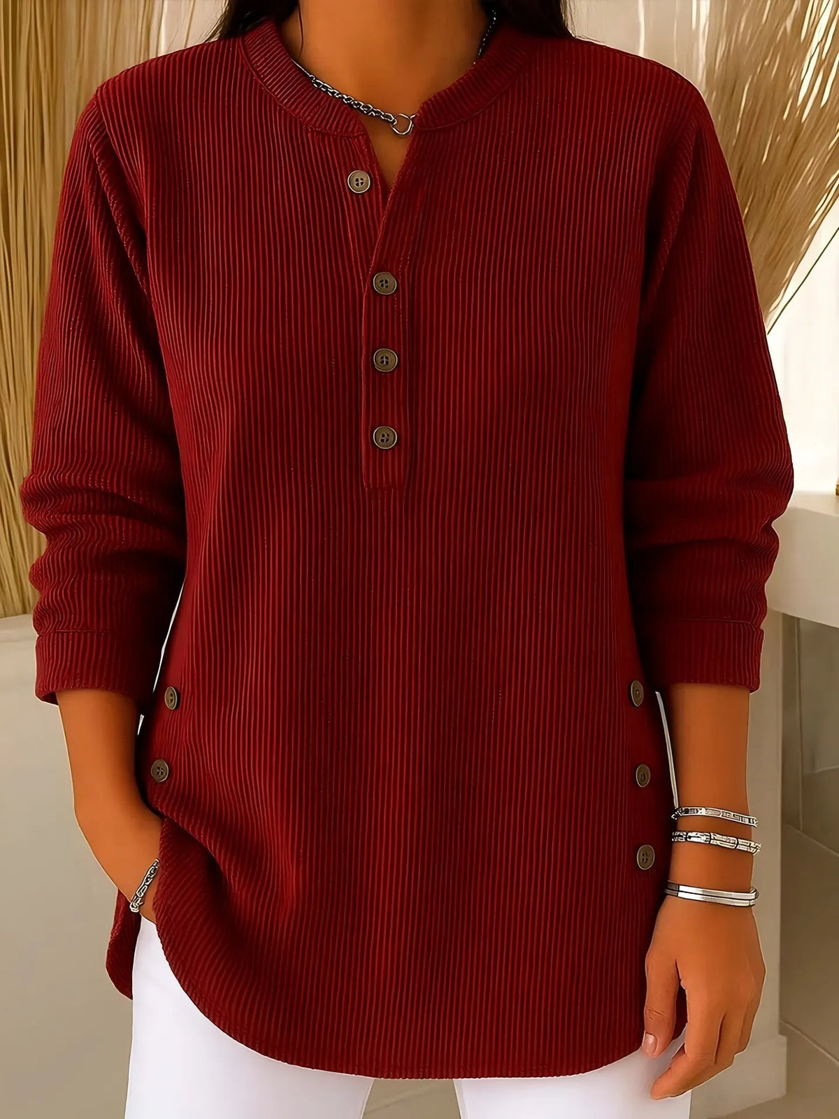 Blusa donna testurizzata con bottoni laterali e maniche lunghe