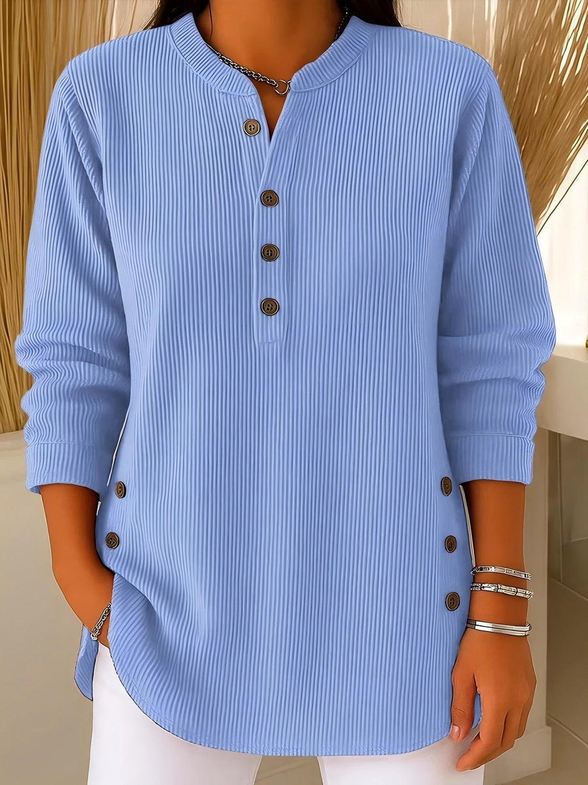 Blusa donna testurizzata con bottoni laterali e maniche lunghe