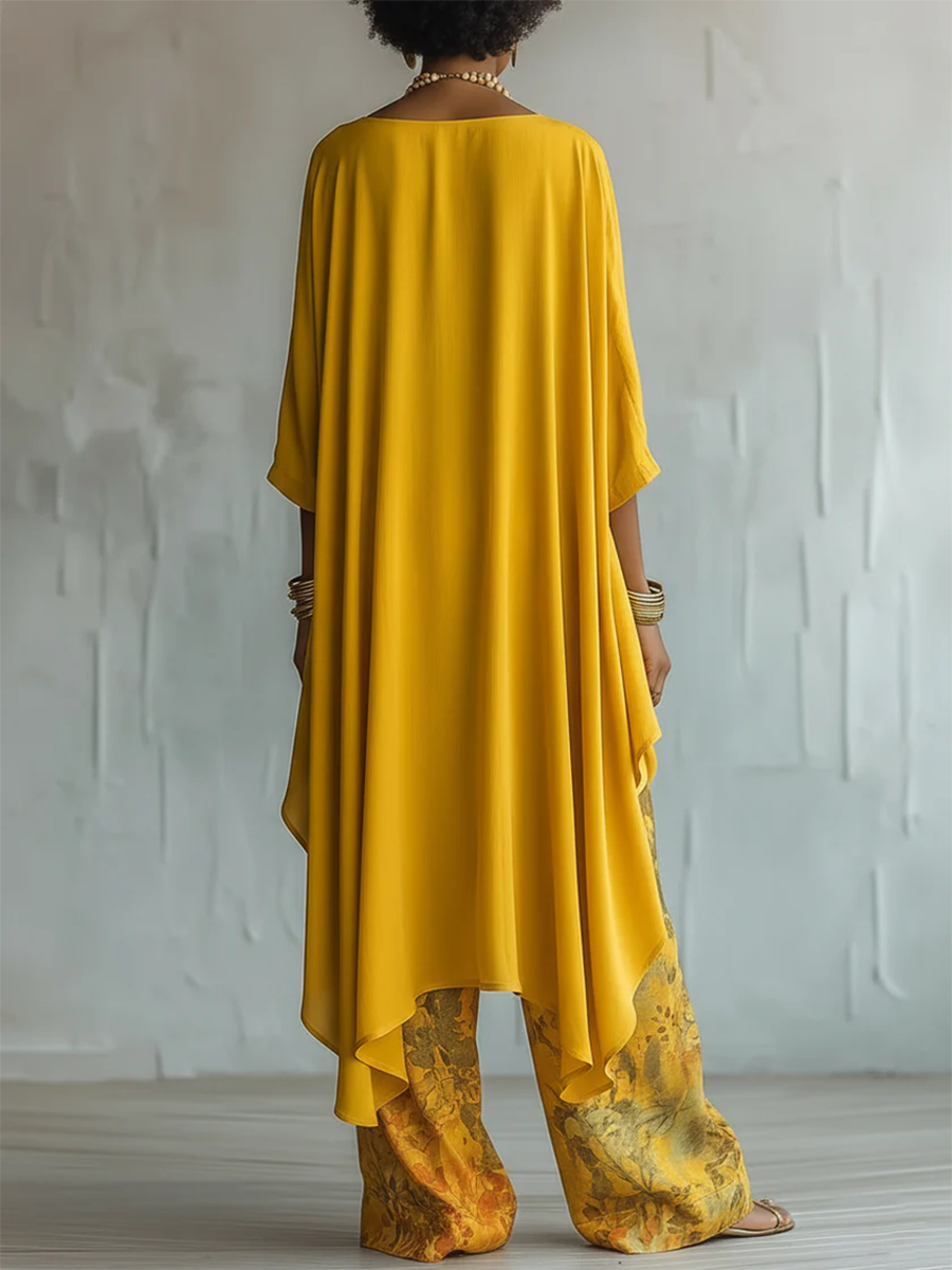 Completo donna boho con blusa asimmetrica e pantaloni floreali