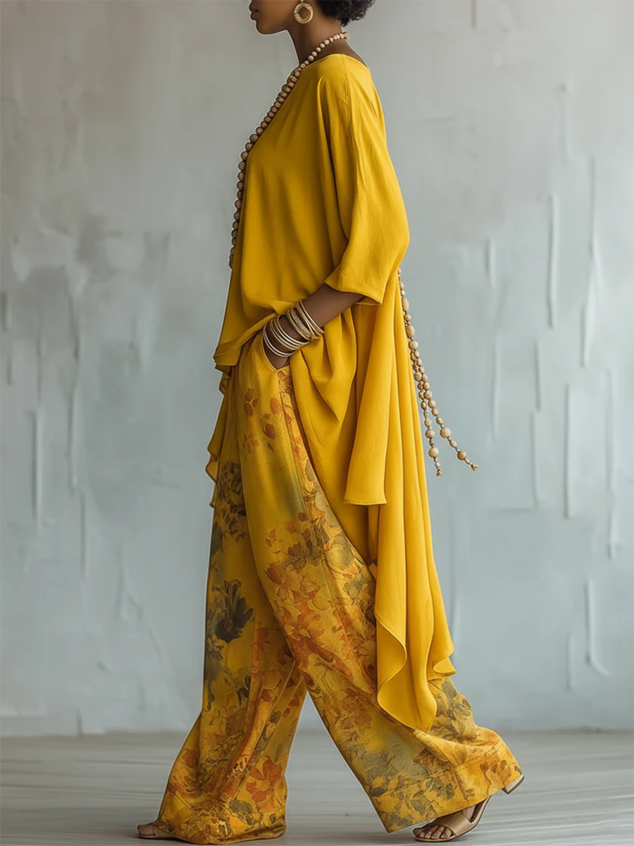 Completo donna boho con blusa asimmetrica e pantaloni floreali