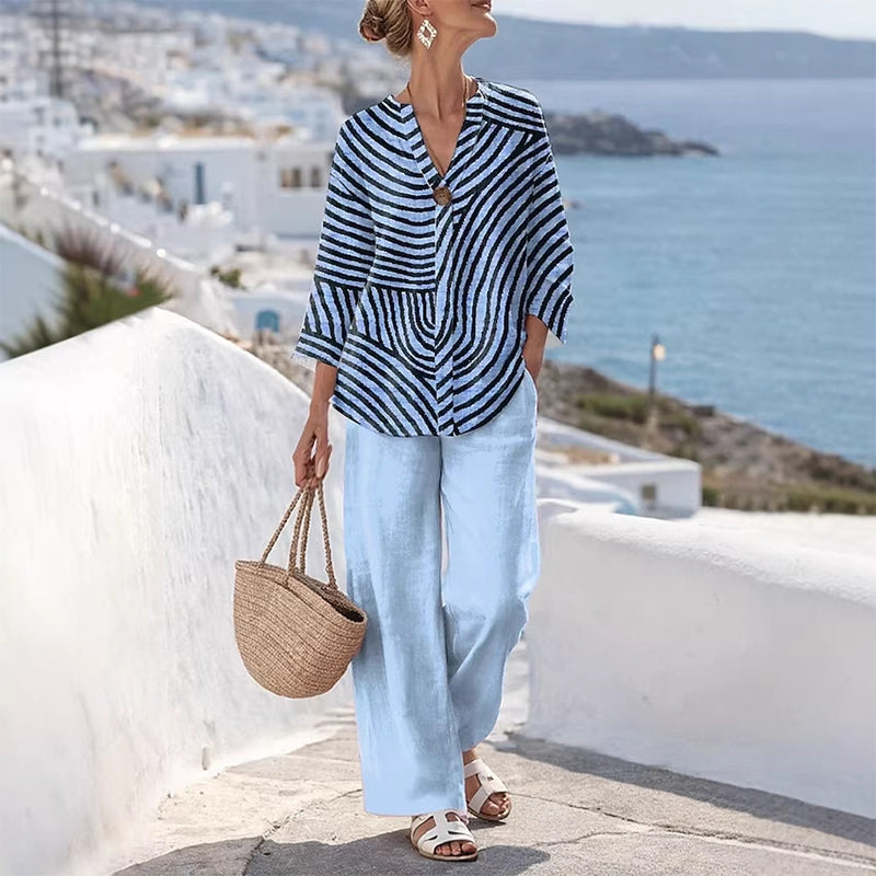 Completo donna a righe con pantaloni larghi